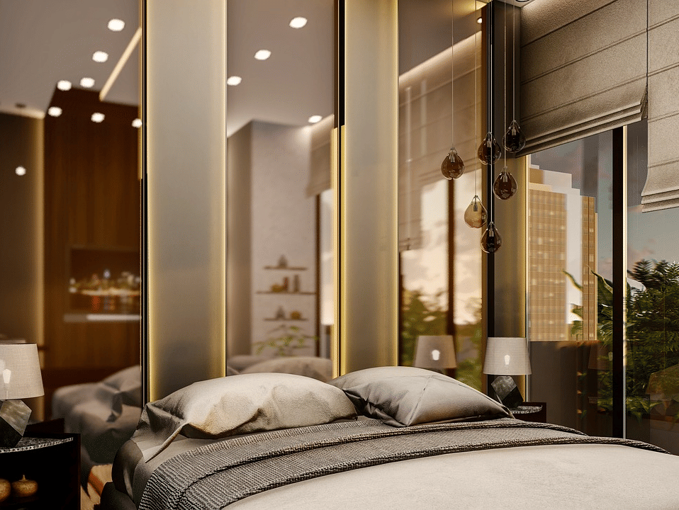 A luxurious bedroom featuring a double bed with few pillows kept over it.