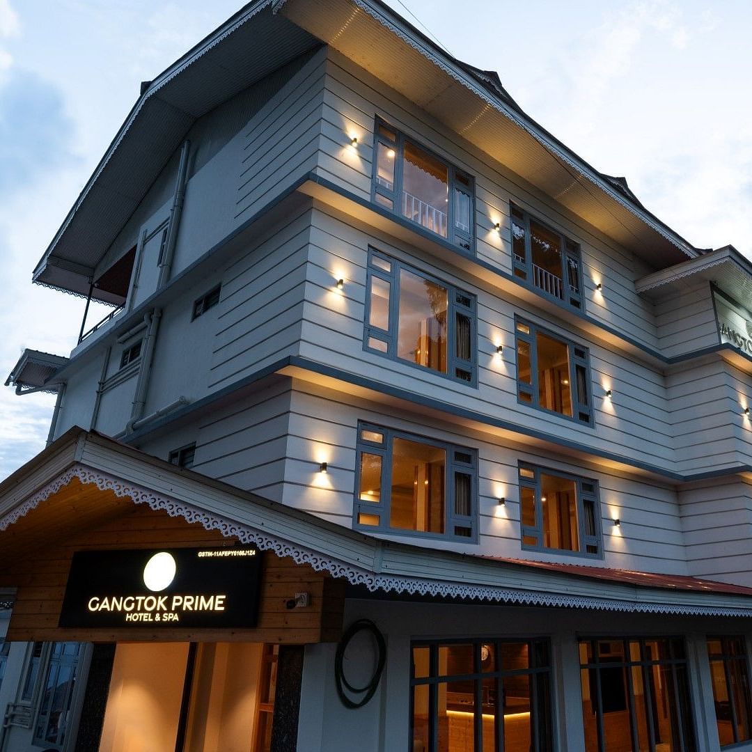 An image of a three storey building and there's also a sky in the background - Avianna Group of Hotels & Resorts