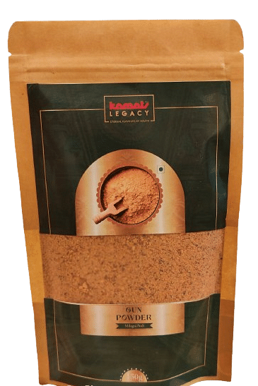 A sealed packet of gun powder of orange and black colour