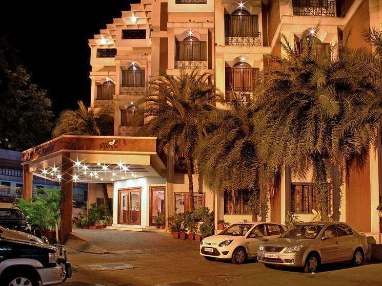 Image if exterior of the hotel with cars parked in the front - Jayaram Hotel, Pondicherry