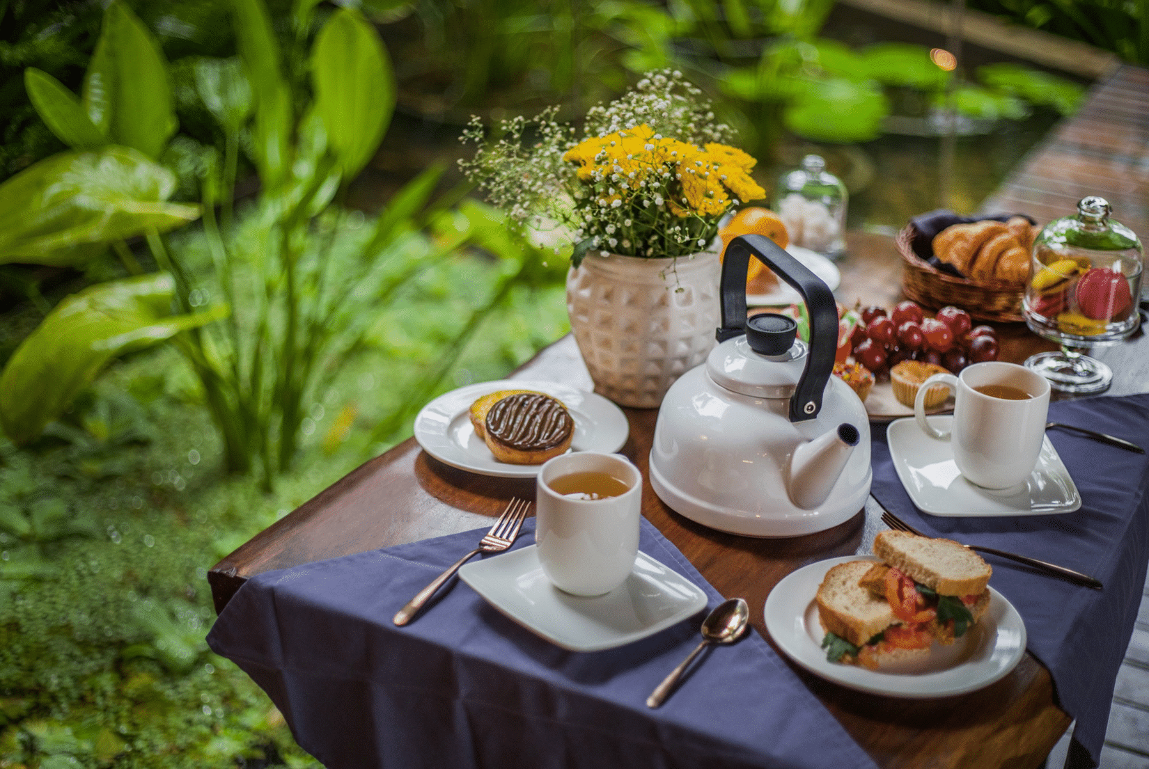Food kept on a coffee table in the garden