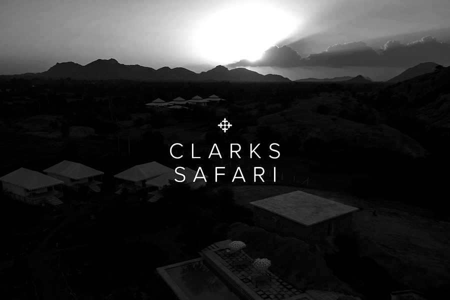 Aerial view of Clarks safari, Jawai with the text saying Clarks Safari