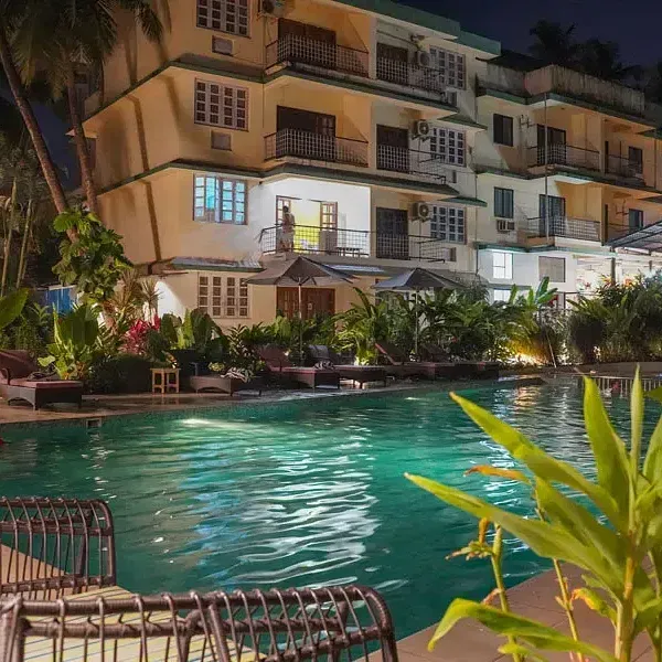 View of swimming pool at night at Indie Stays Resort, Goa.