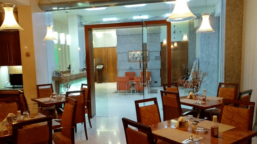Dining setting of a restaurant at Regency Hotel, Mumbai.