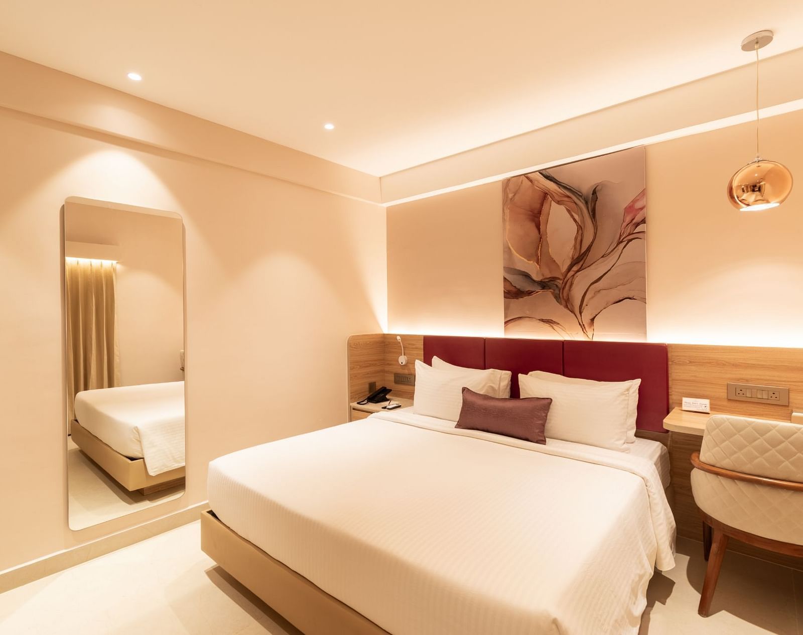 Comfortable bed setup in The Premium Rooms at TGI Livancia The Sojourn, Bangalore.