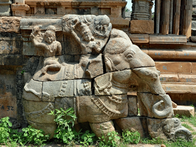 Carved idol of an elephant on the staircase of an ancient architecture.