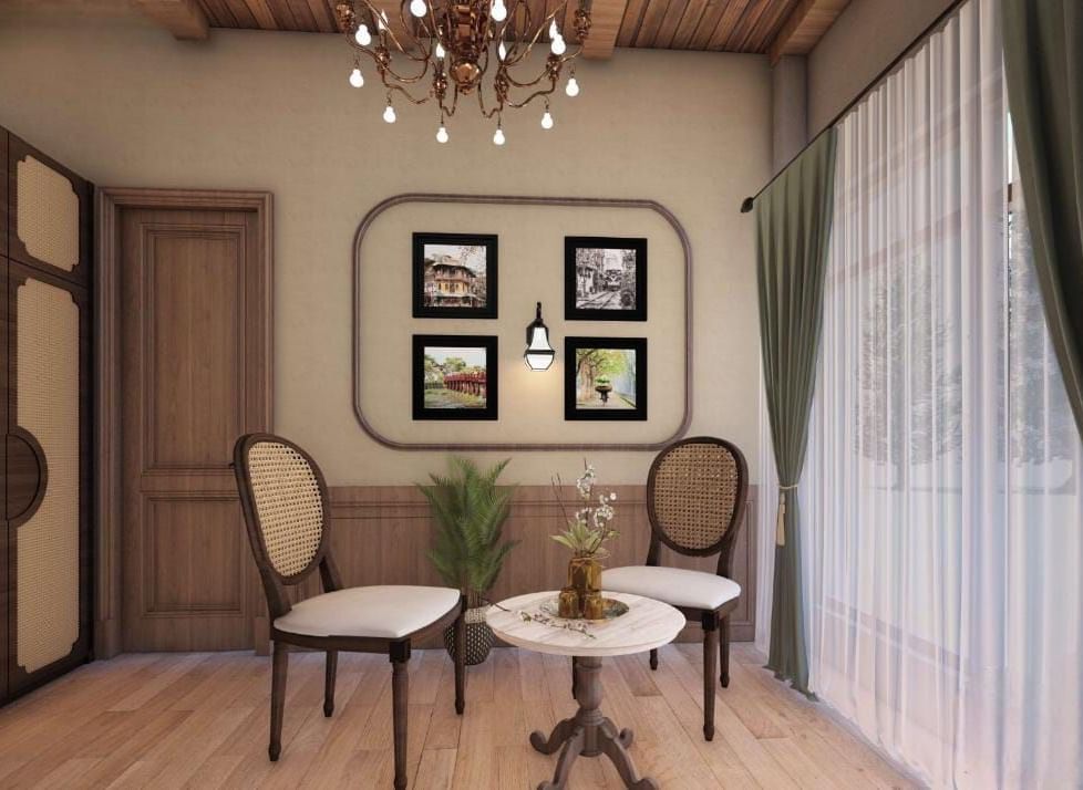 Small sitting area with circular wooden doors, a rounded picture frame, and elegant traditional chairs at BluSalzz Terrah Hills Resort, Dalhousie.