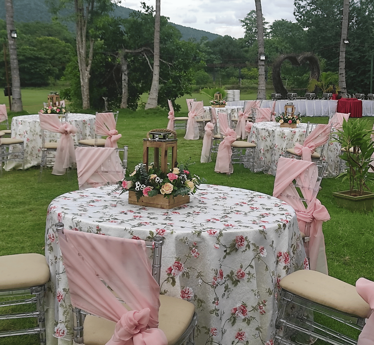 An event space at Avana Resorts, featuring decorated chairs and tables set for an event.