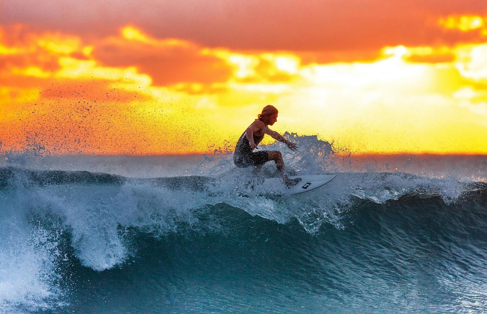 A man surfing on waves.