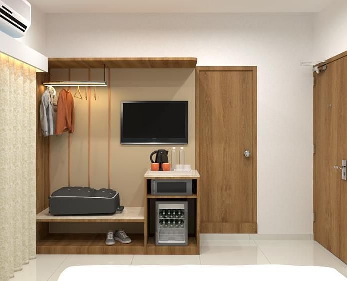The wardrobe area with mini-bar in view inside one of the rooms - TGI Livancia The Sojourn, Bangalore