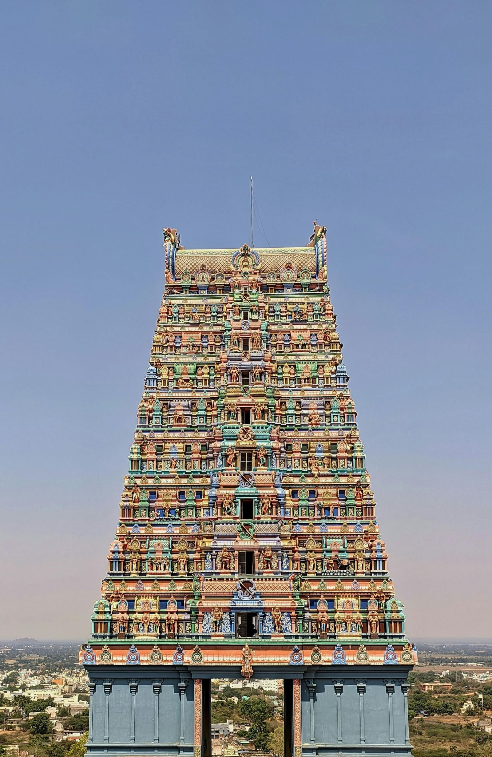 A front view of a gopuram of a temple on clear, blue day