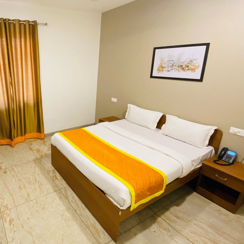 Super Deluxe Room side view double bed and wardrobe - Southern Grand Kashi