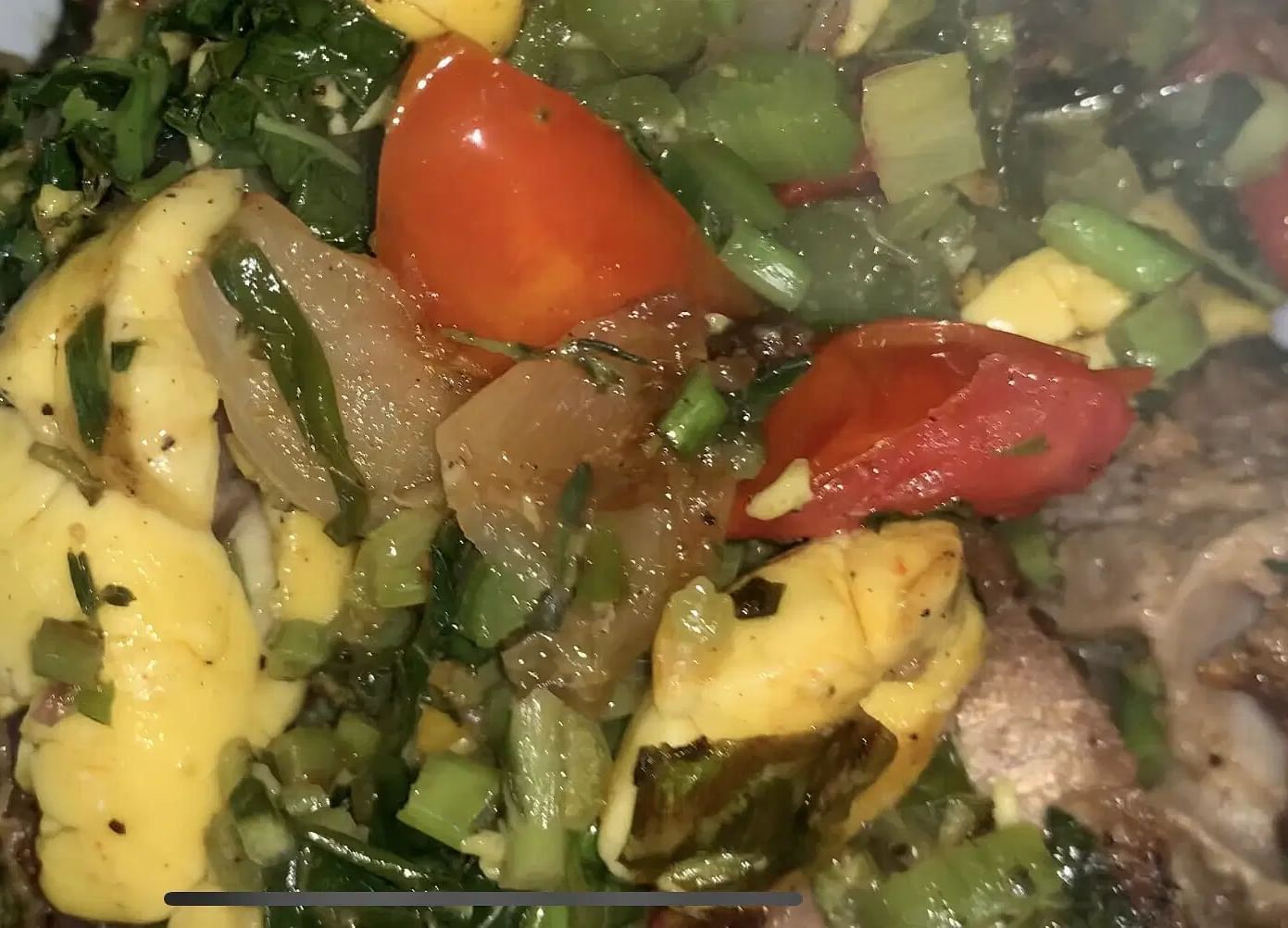 A meal featuring meat and a green salad | Altamont Court, Jamaica