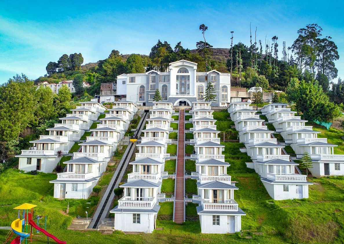 Exterior of a hotel on a hillside during the day
