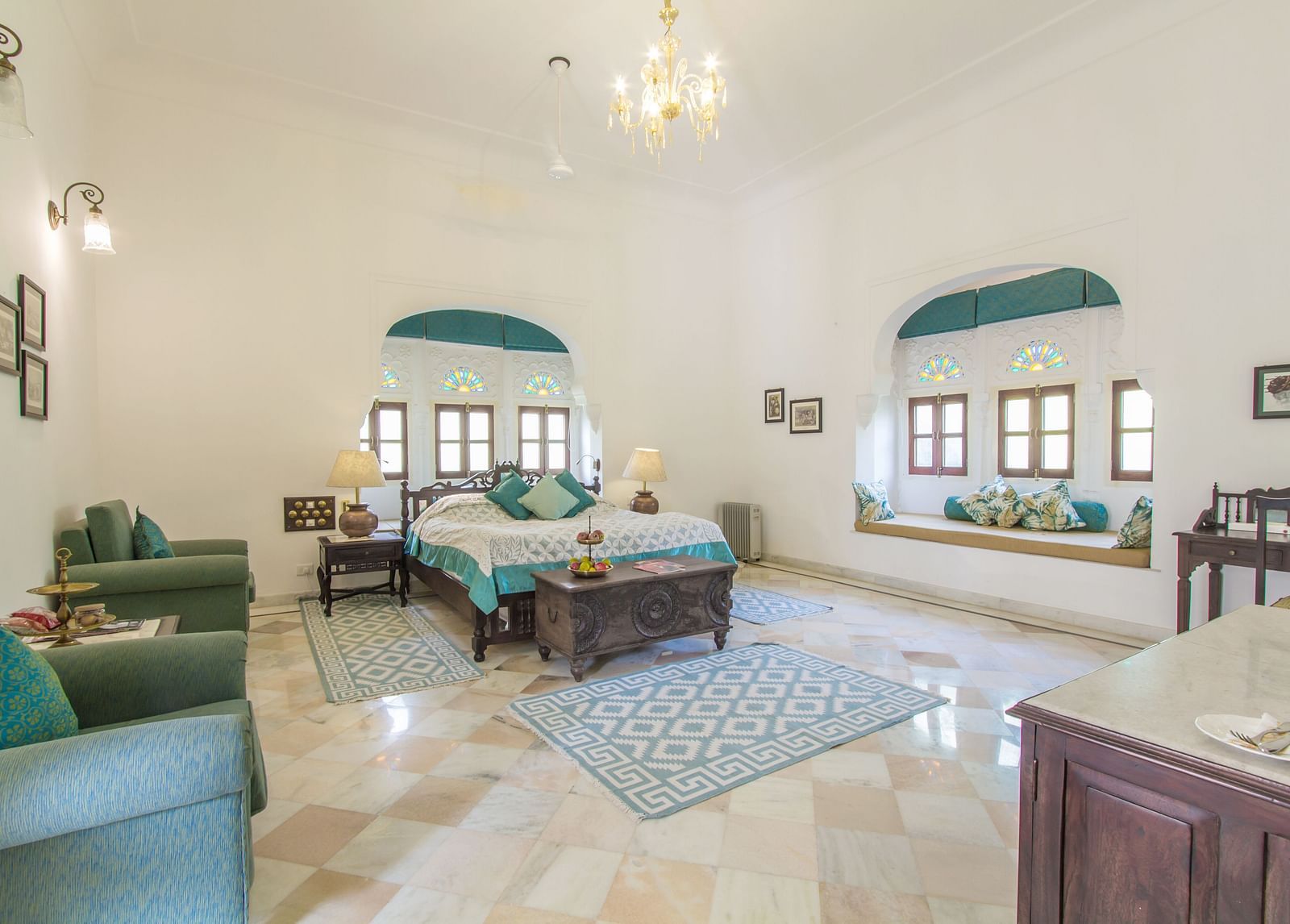 Deluxe suite with a double bed and seating arrangement- Dev Shree, Deogarh