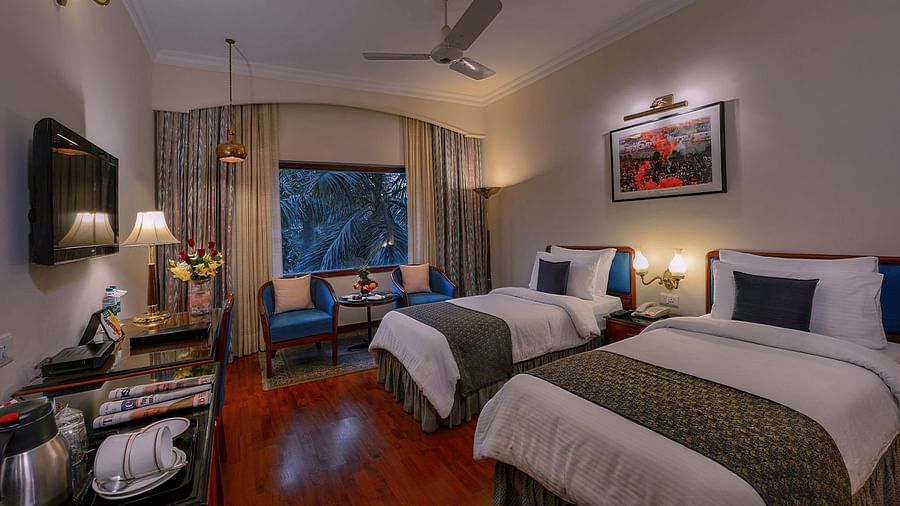 Clarks Varanasi - the twin beds kept beside the window at the Premier Room
