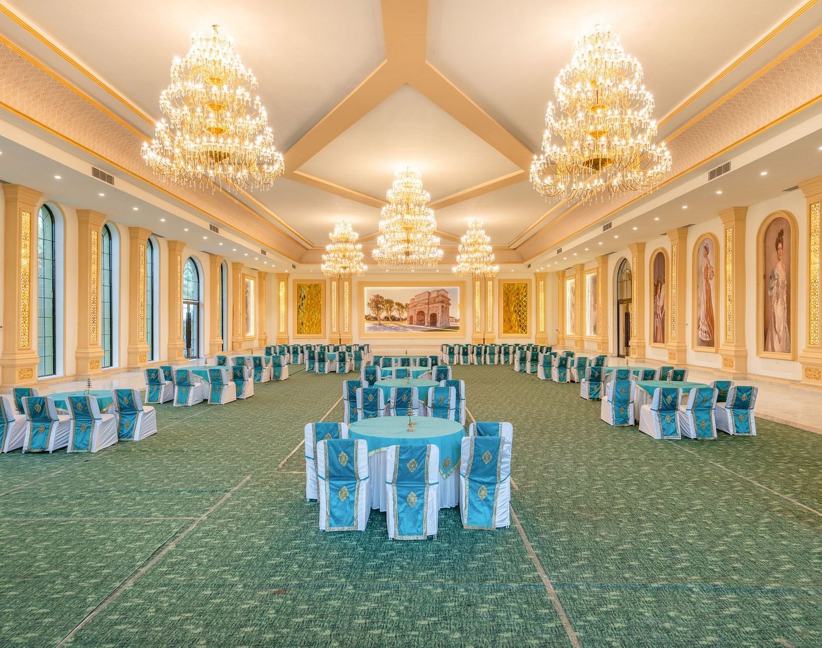 Rear view of a banquet hall at Valley by Grassfield, featuring round tables and chairs.