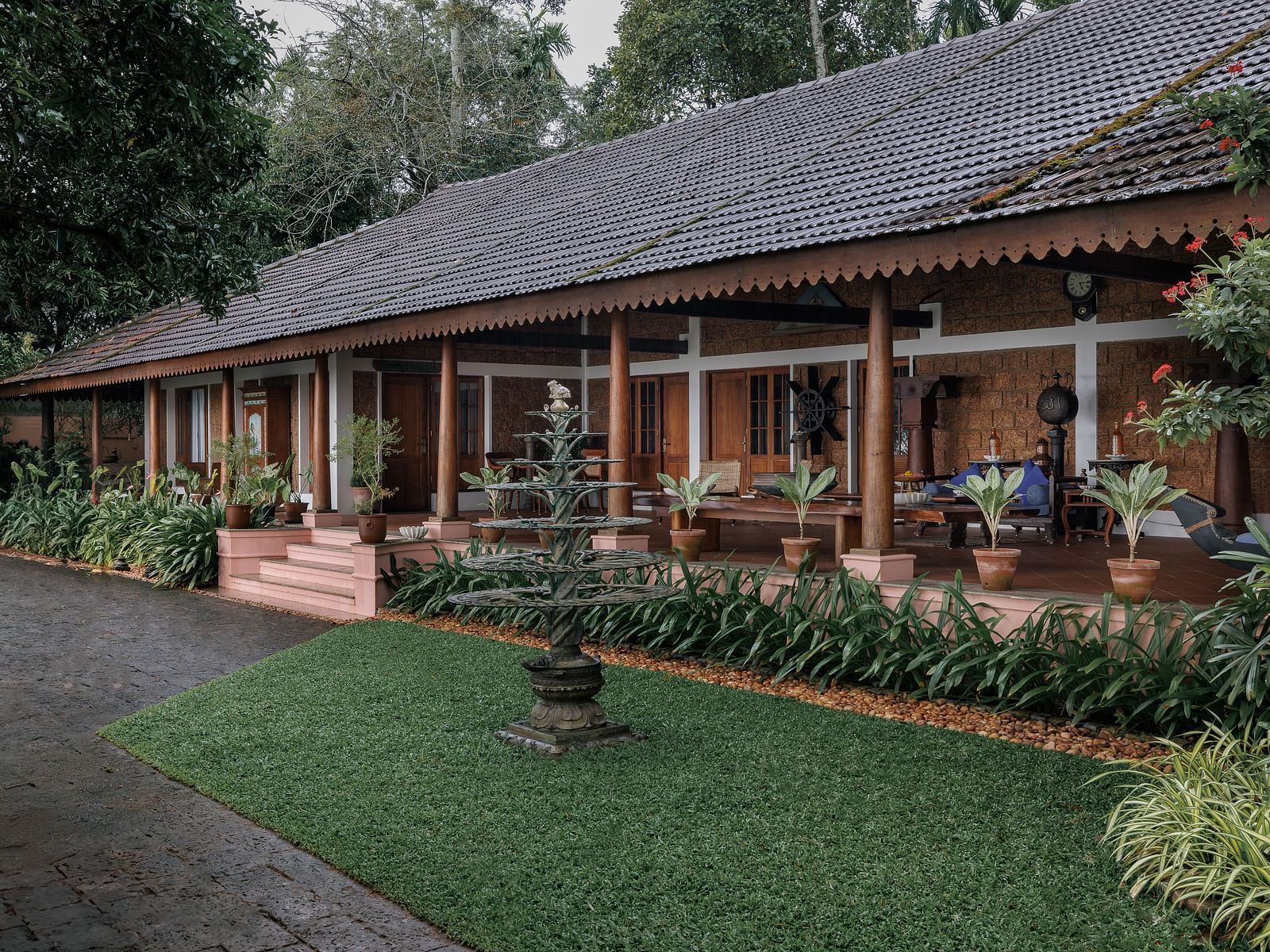 A facade of BluSalzz Villas - Muhamma Resort, Alleppey featuring the villas and greenery around it