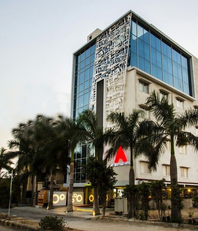 Facade of Art Boutique Hotel, Hyderabad with trees in front of it