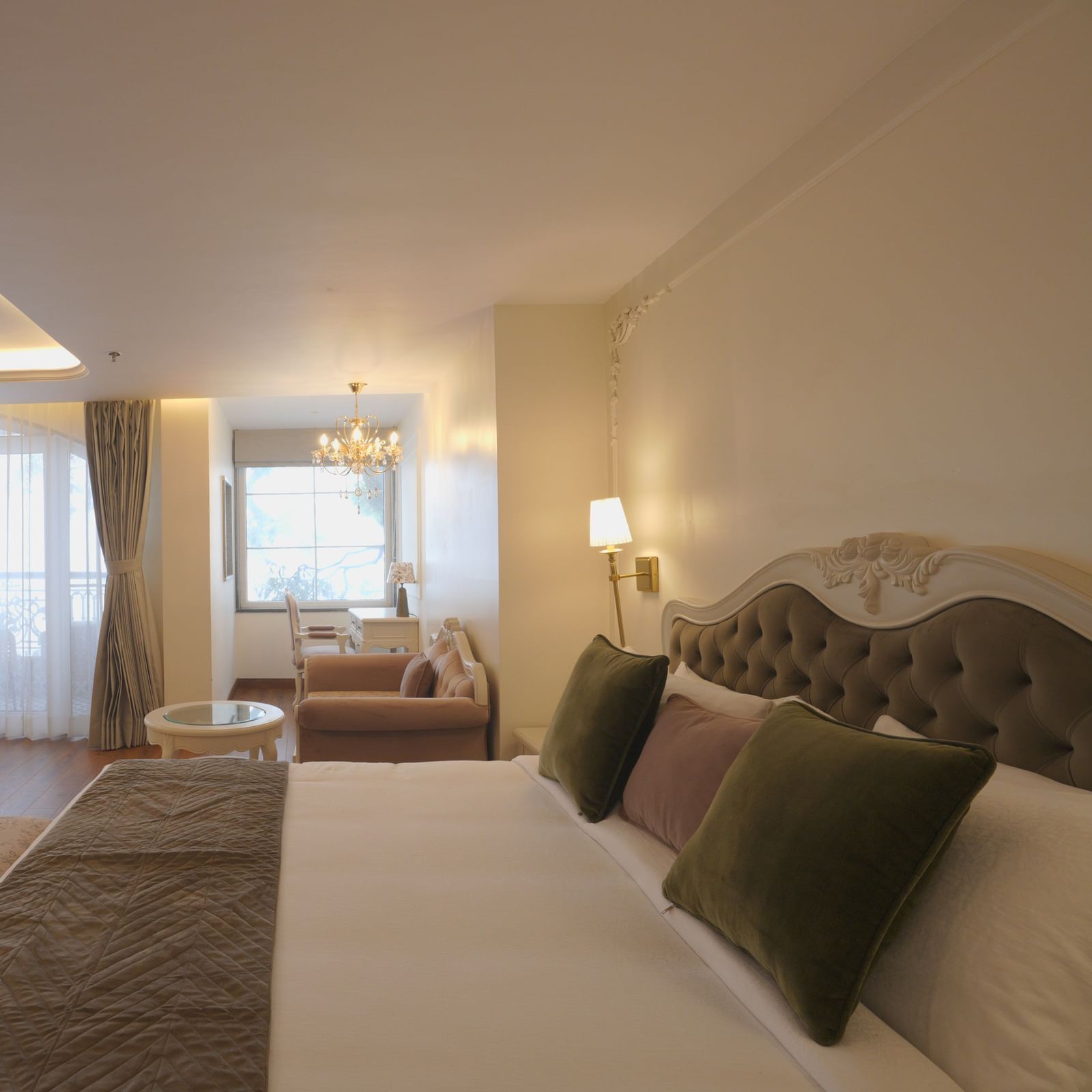 Premium bedroom featuring a plush bed, large windows, and subtle decor - Mayfair Cafe & Suites, Dalhousie