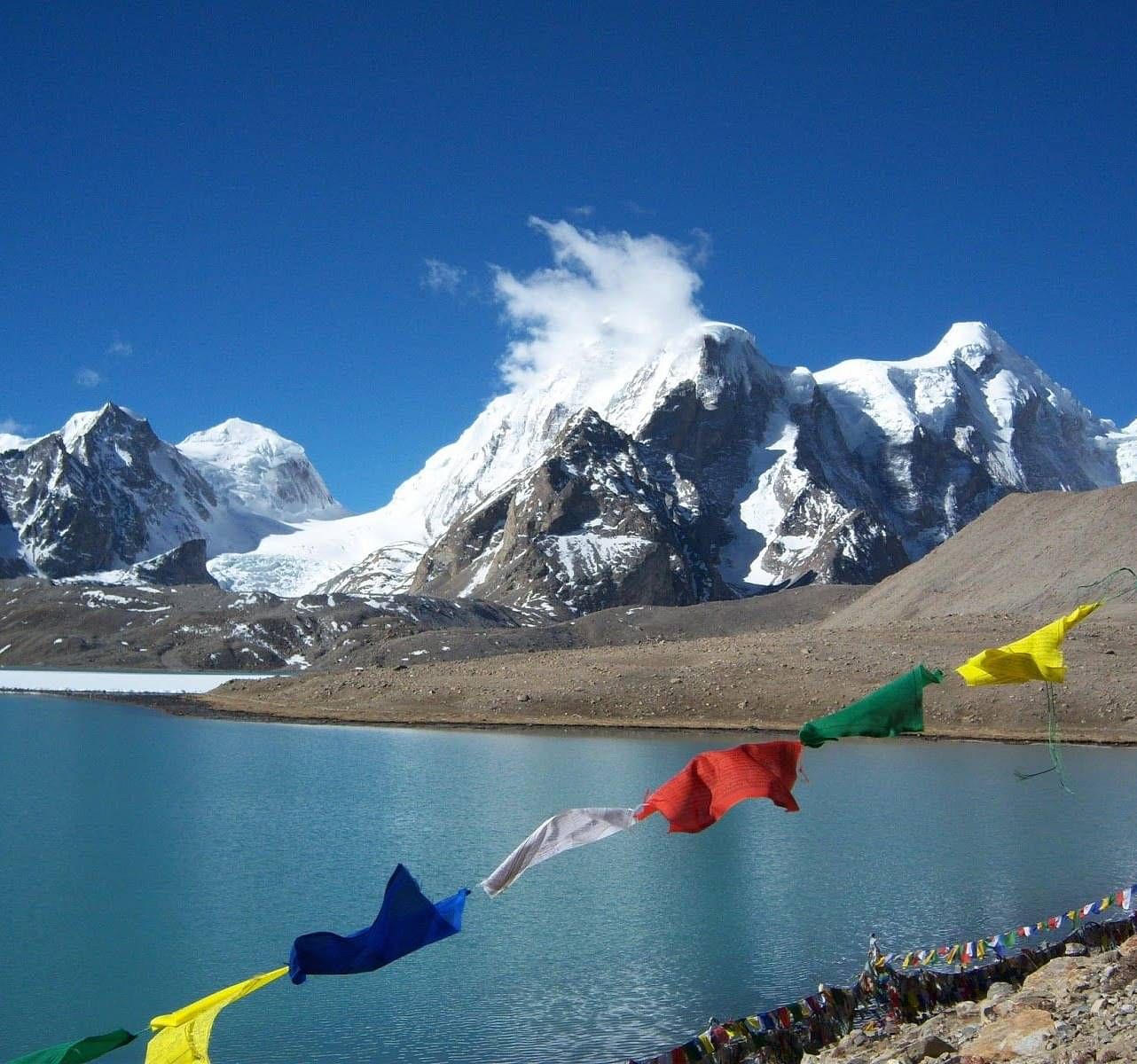 Image of Buddhist Prayer Flag with snow clad montain in the background