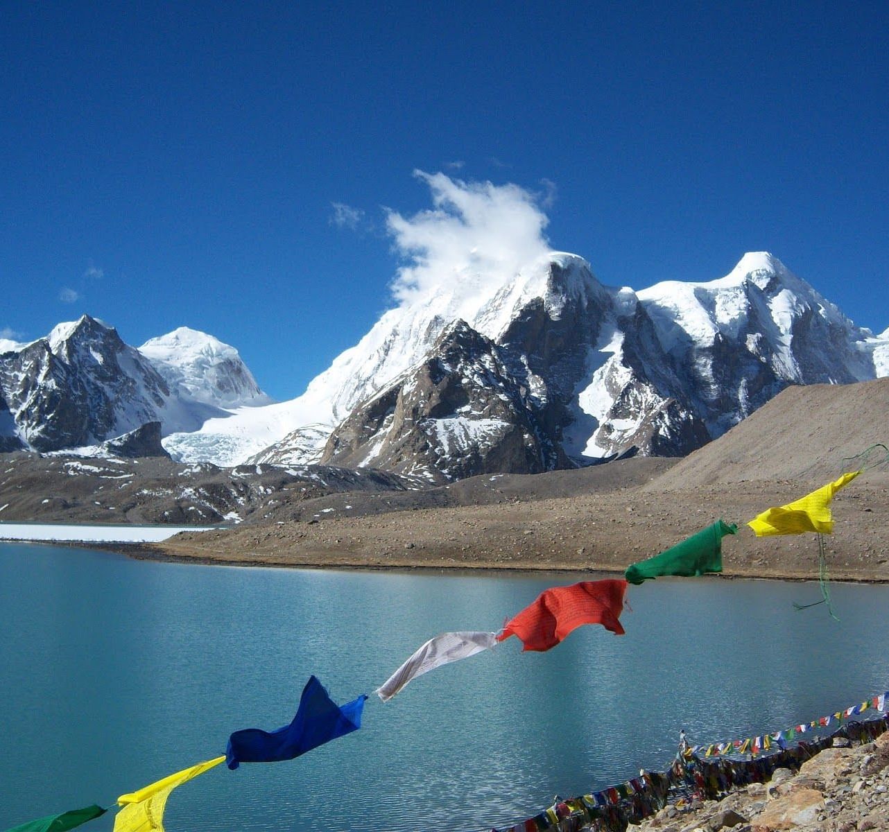 Image of Buddhist Prayer Flag with snow clad montain in the background