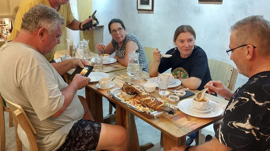 Dining-  table conversation among a group of four.