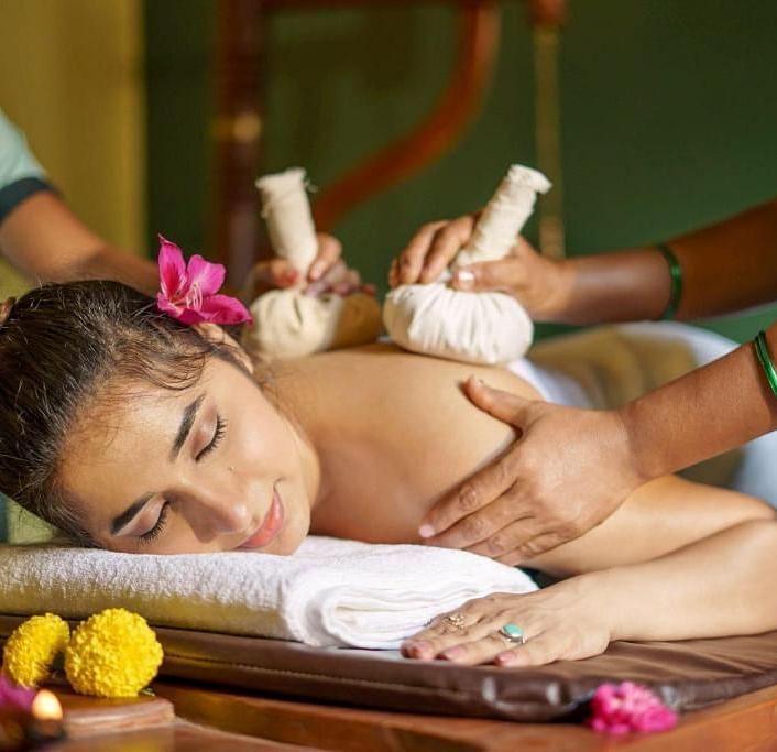 Two Spa Therapists massaging a model at Ocean Spray Puducherry 