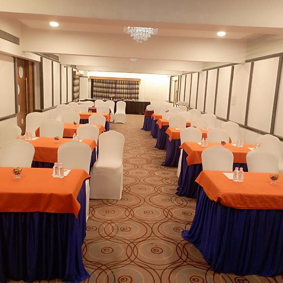 Event hall at Rang Lords Inn, neatly set up with chairs and tables