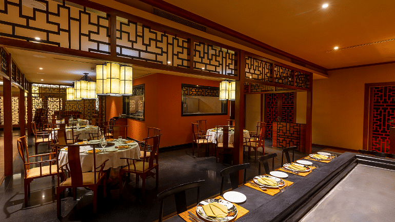 A well-stocked bar with a variety of spirits and mixers, ready to serve customers.