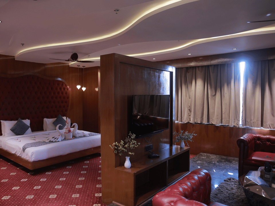 Skyline by Miraya, Sky Suite, Bed and living area under cove lighting