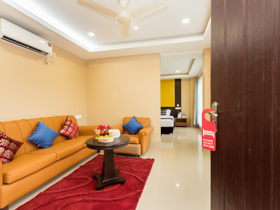 A door at Central Courtyard Boutique Hotel, Siliguri, opening to the sitting room of the suite