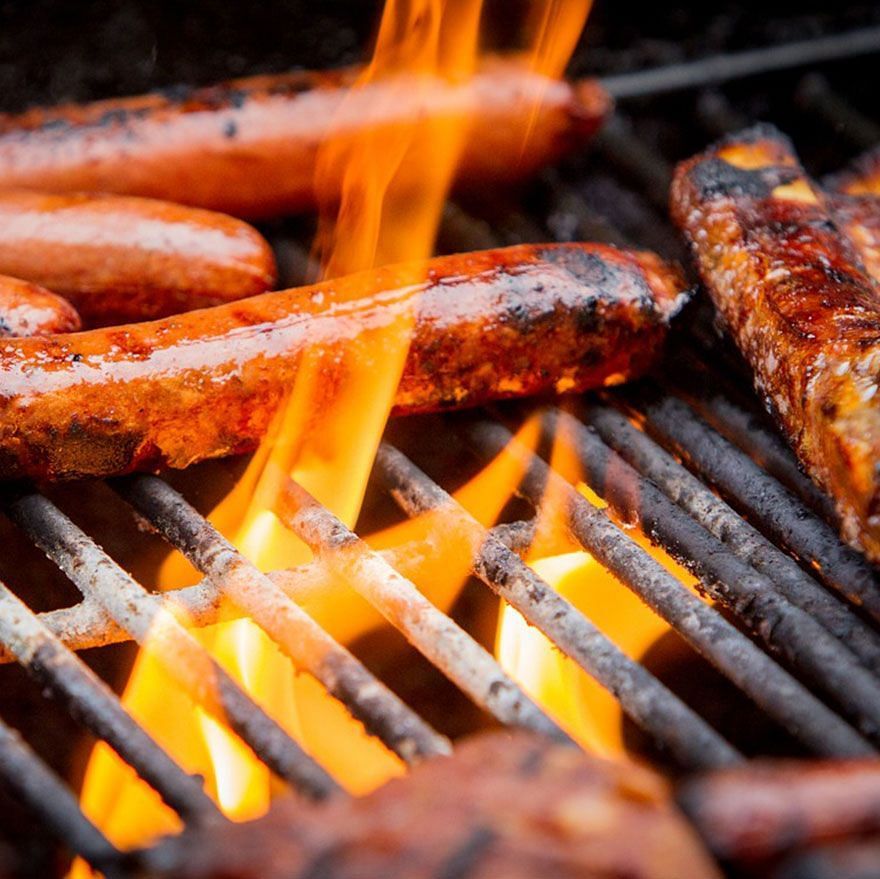 sausages being grilled on the barbecue