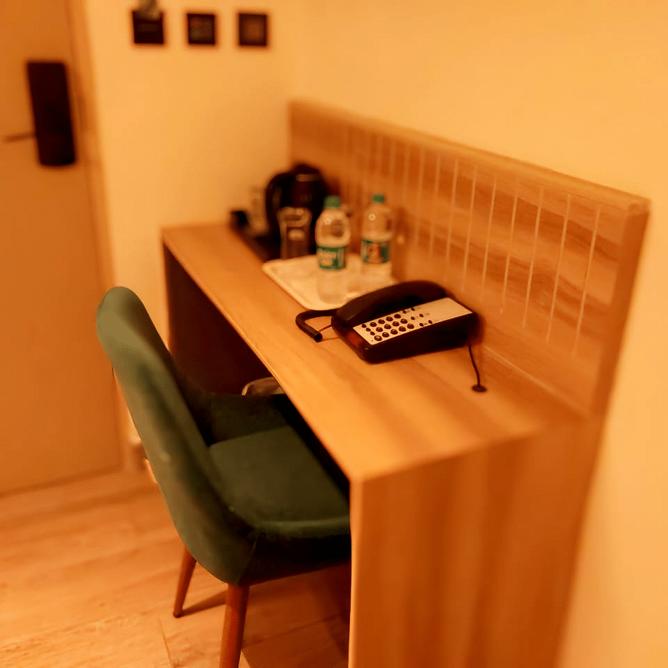 Image of a room with study area equipped with a chair and a table.