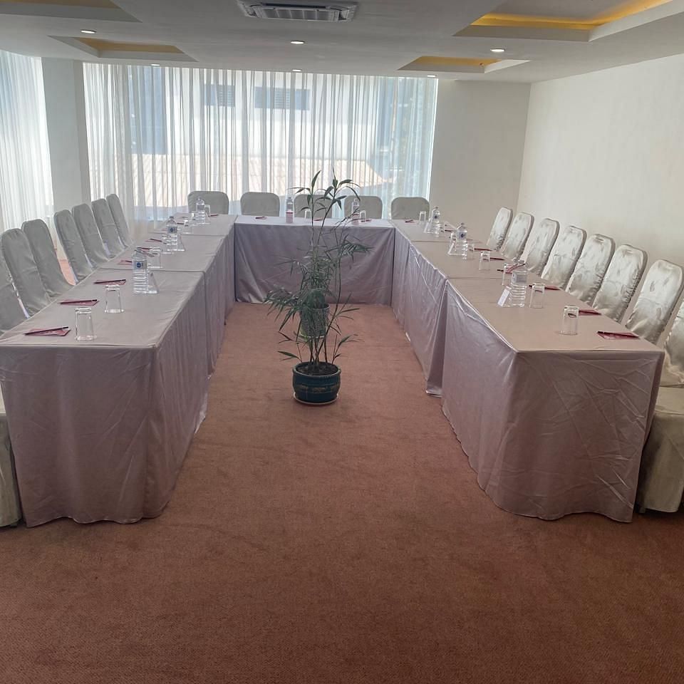 A banquet hall, windows with curtains 