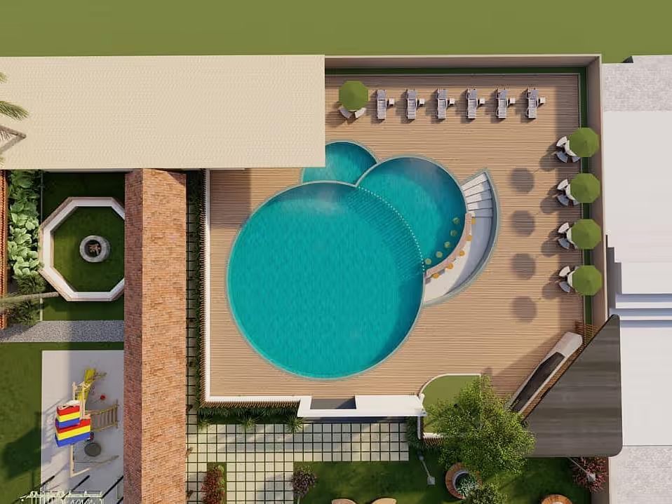 An aerial view of a resort layout, featuring a pool, buildings, and landscaping elements.| Ayana Resorts & Convention, Hyderabad