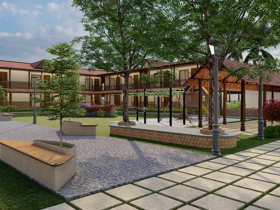 Exterior view of a resort building with a concrete seating area and landscaping | Ayana Resorts & Convention, Hyderabad