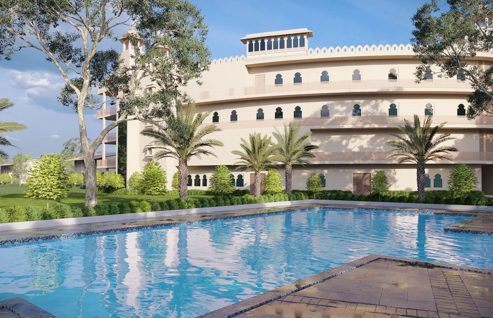 Bamboo Saa Sunrrise Wedding & Wellness Resort, Jaipur, with an outdoor swimming pool and sun loungers in a sunny setting.
