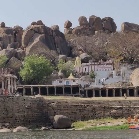 Ancient temple complex with boulders by Tungabhadra River.
