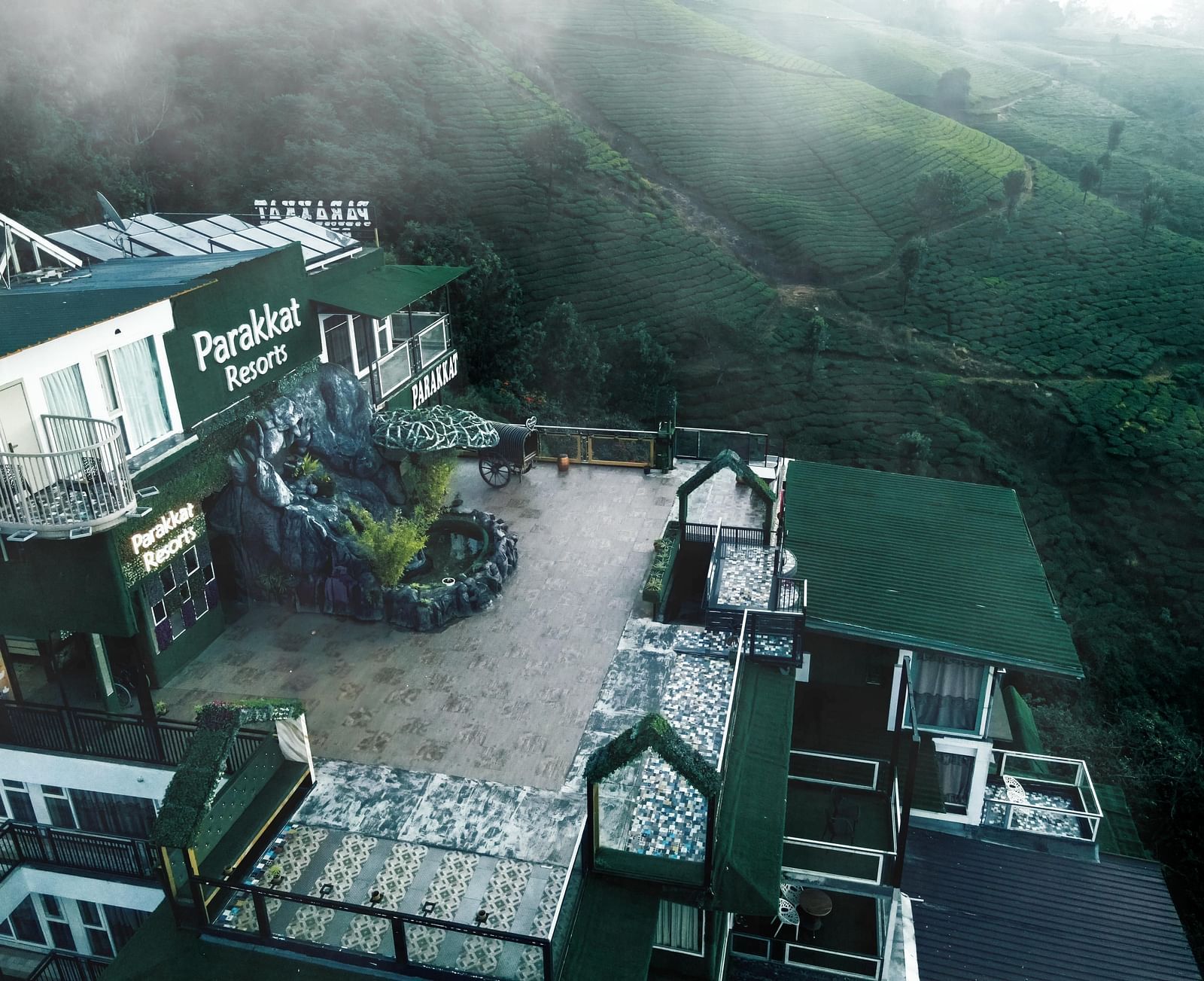 View of the Facade of Parakkat Nature Hotel and Resorts, Munnar amidst the fog 