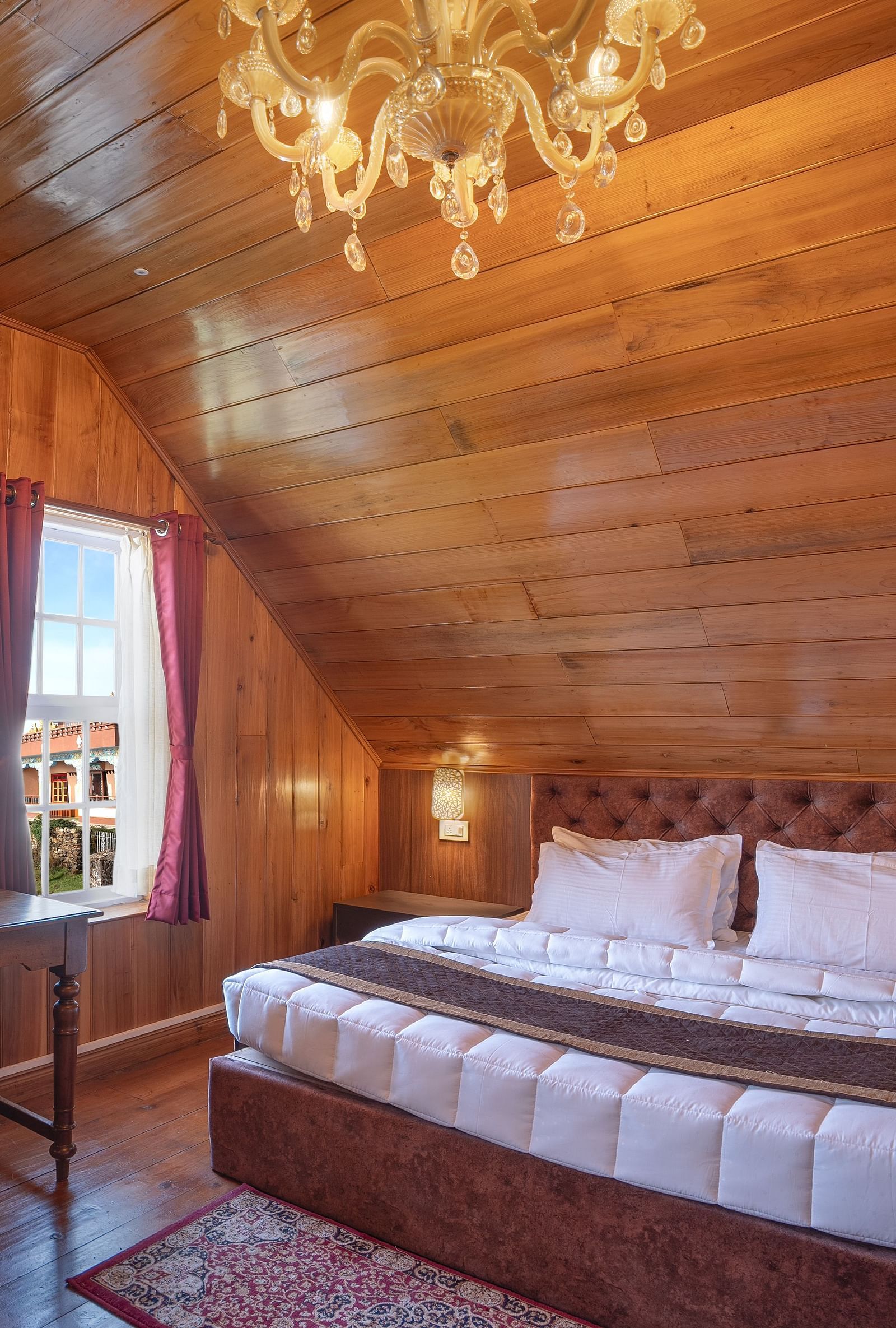 A room at Poshtel, Meghma with a double bed and side tables