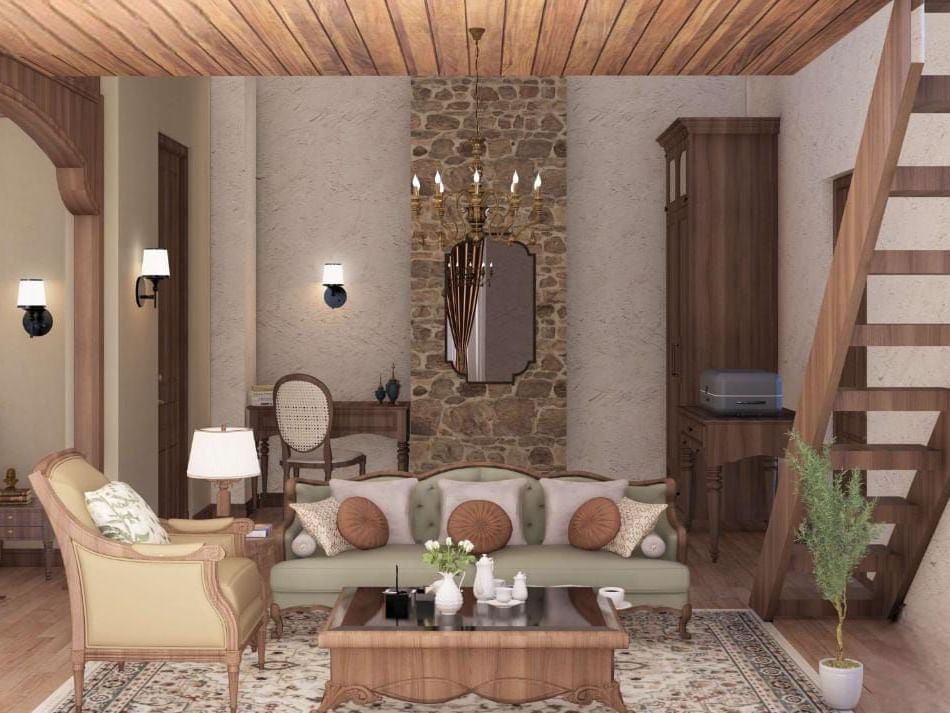 Rustic living area with a wooden staircase, stone wall details, and a sofa with patterned cushions at BluSalzz Terrah Hills Resort, Dalhousie.