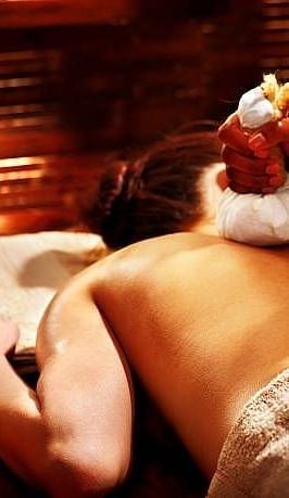 a Women getting a massage in the spa at Ocean Spray Puducherry 