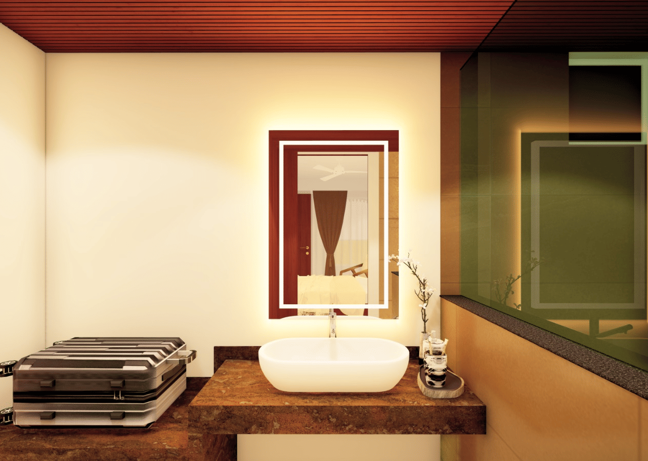 Interior view of a modern washroom featuring a wash basin counter, mirror, and dark brown and red-toned decor at Palolem Beach Resort, Goa.
