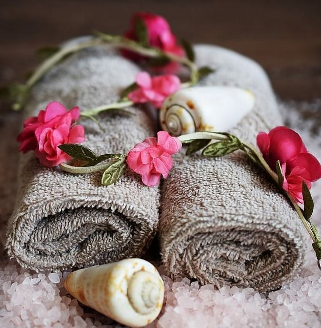 Image of towels with flowers on top of it