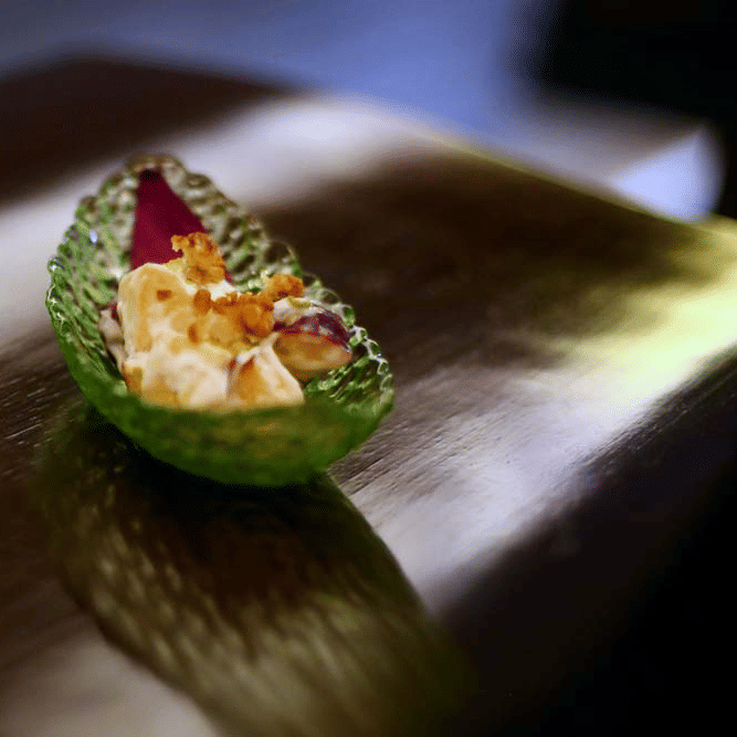 A dish placed in a boat shaped leaf | The Bristol Hotel