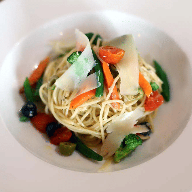 A plate containing noodles with vegetables | The Bristol Hotel
