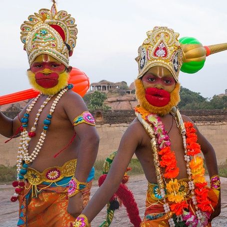 Three young performers in traditional Hanuman look in hampi