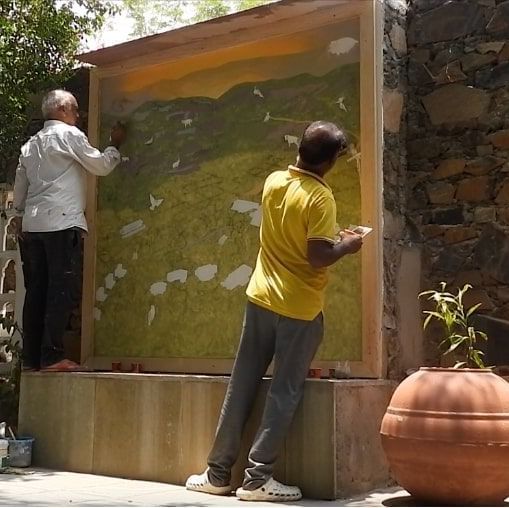 Artists filling colours on the naturalist map in progress at Utsav Camp Sariska.