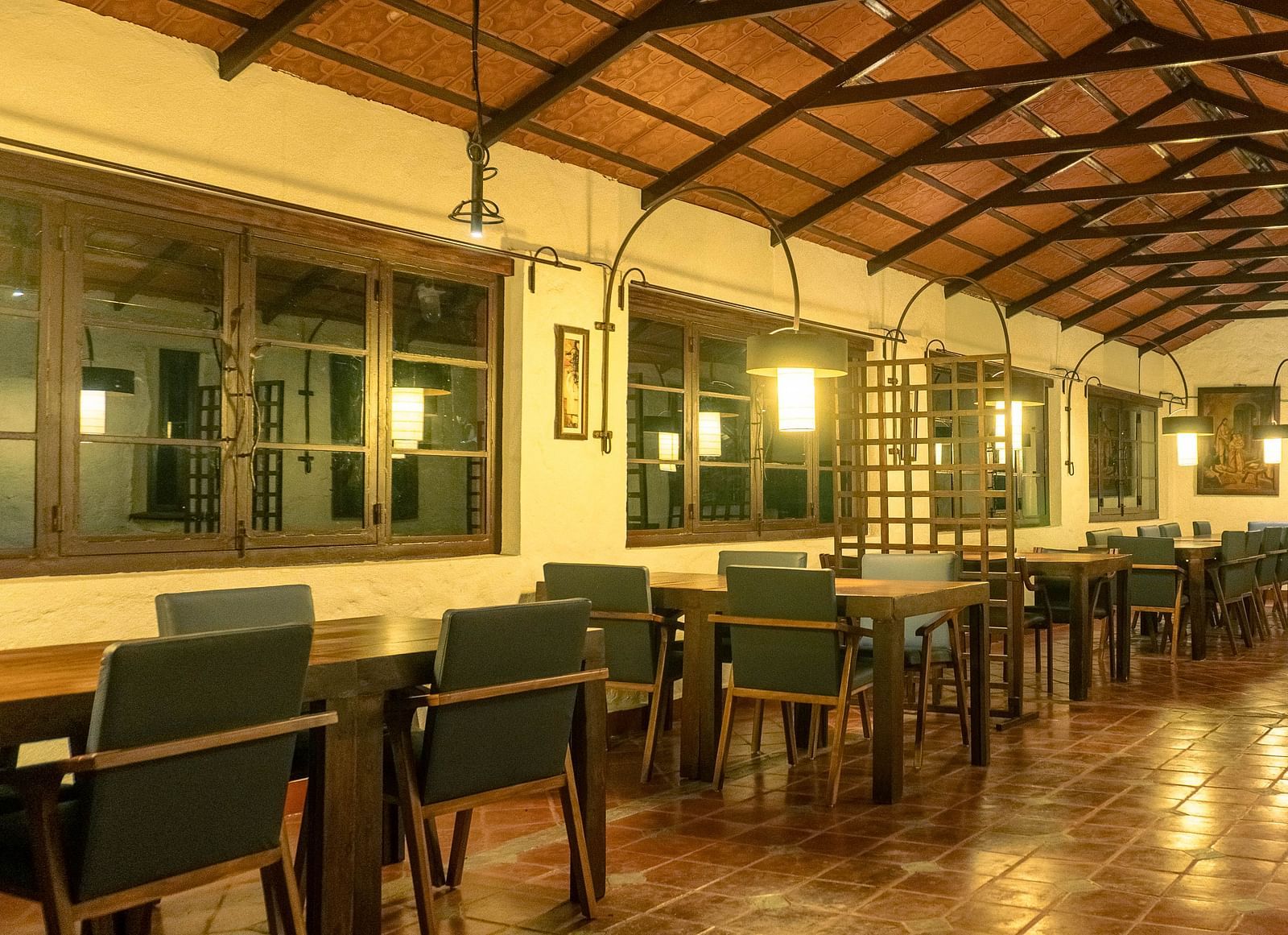 Warmly lit dining hall with wooden interior  | Mango Hill, Yercaud